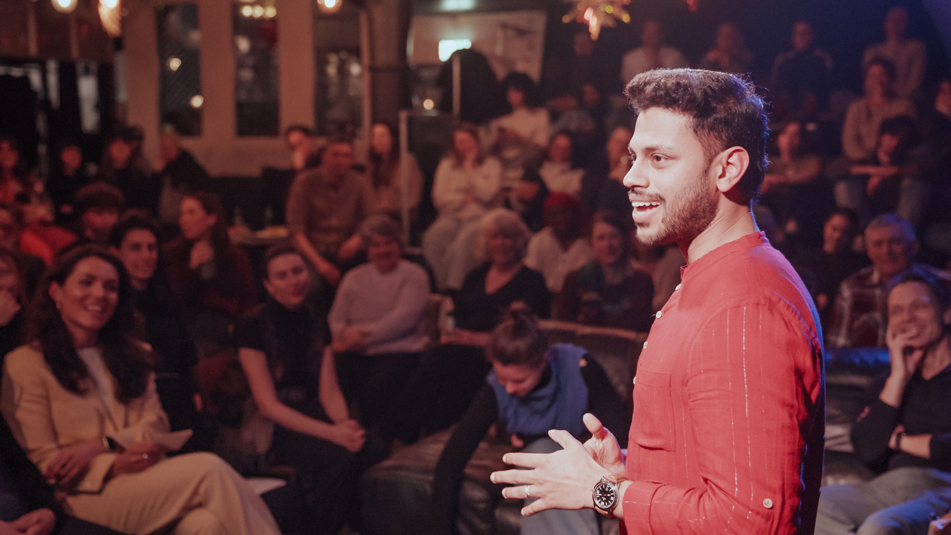 Rooted speaker Rahul sharing a story among large audience at Mezrab